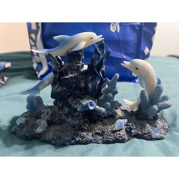 Dolphins Swimming Around Coral Statue‎ - Picture 2 of 3